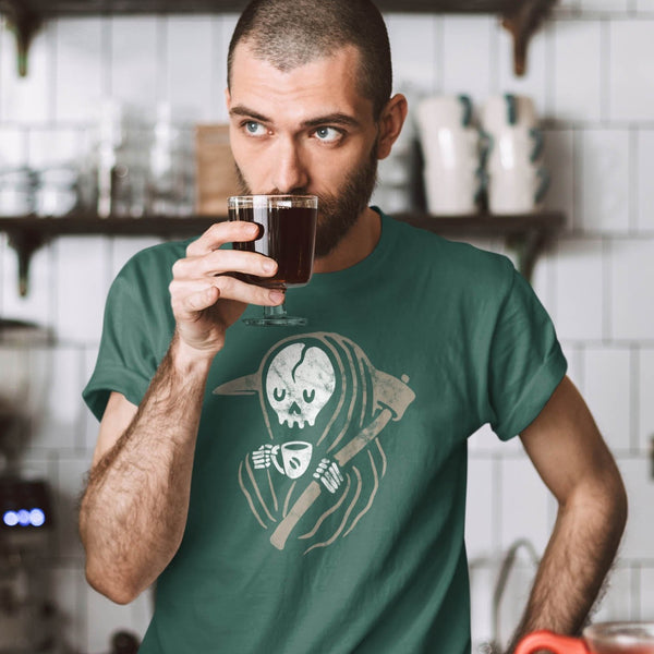Man enjoying coffee wearing a funny grim reaper t-shirt from Shirty Store