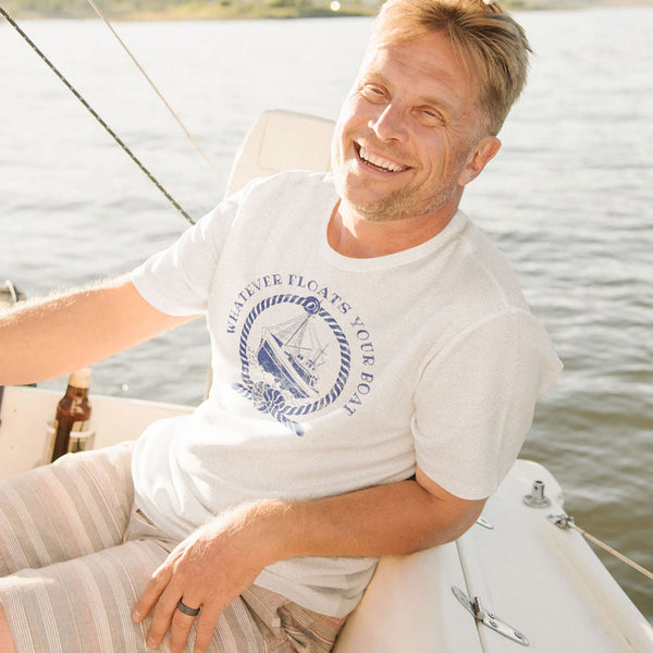 Man on boat wearing funny sarcastic Whatever Floats Your boat t-shirt from Shirty Store